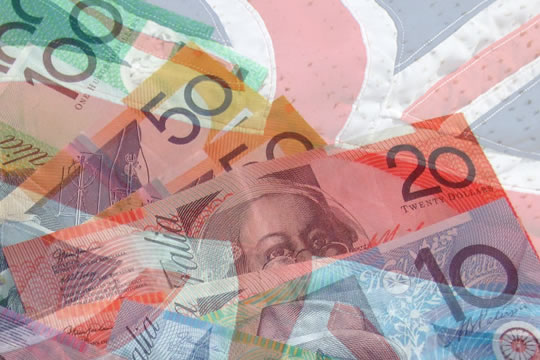 Composite image of Australian bank notes overlaying a waving Union Jack flag. - Baldwin Financial Services | Prospect Financial Advisors.
